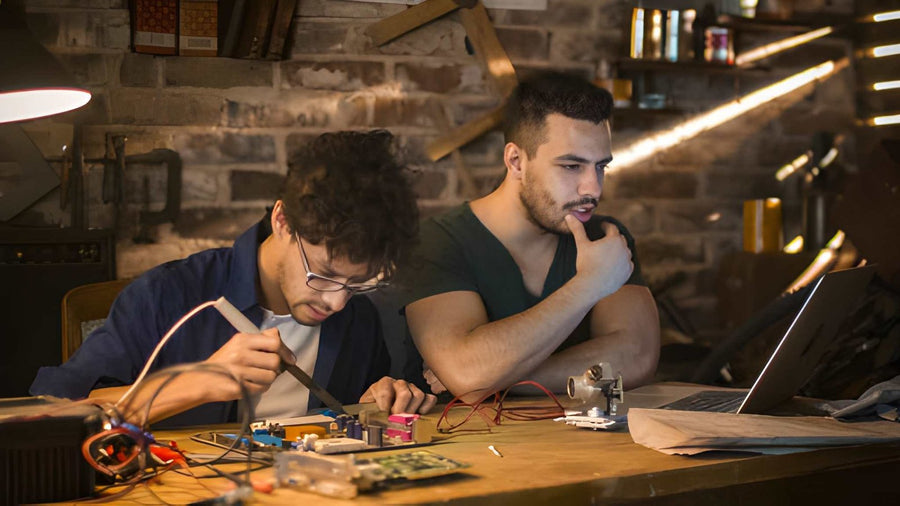 Two brothers, one repair bench